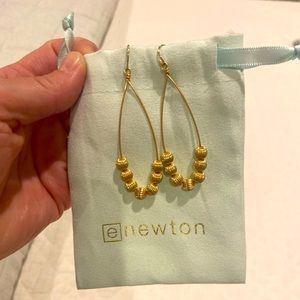 E Newton gold dangle earrings.